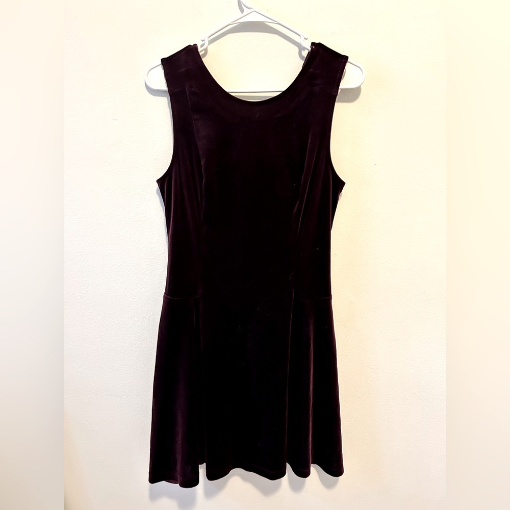 Deep purple, velvet dress with a high neckline and cute open back v shaped cut
